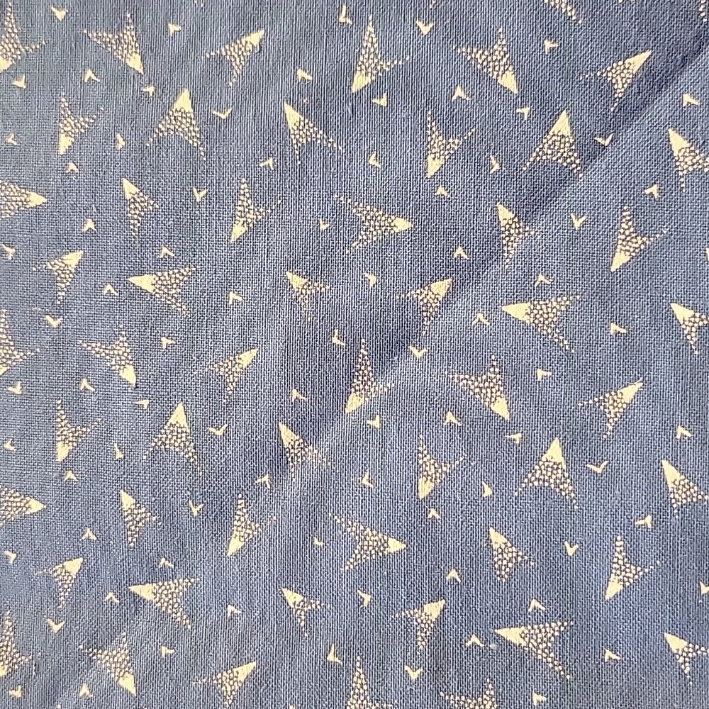 Light blue with small white bursts  cotton quilt fabric 1/2 yd